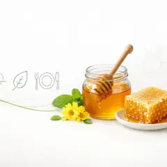 Słoik miodu, plastry miodu, kwiaty i liście. Ikony serca, liścia i sztućców sugerują, czy miód jest zdrowy i naturalny.